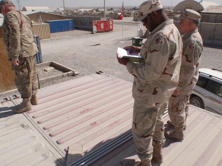 During his recent deployment to Afghanistan, Robert Medlock (center) managed construction projects in Afghanistan, one of which was on Forward Operating Base (FOB) Shank in the Logar Province. 