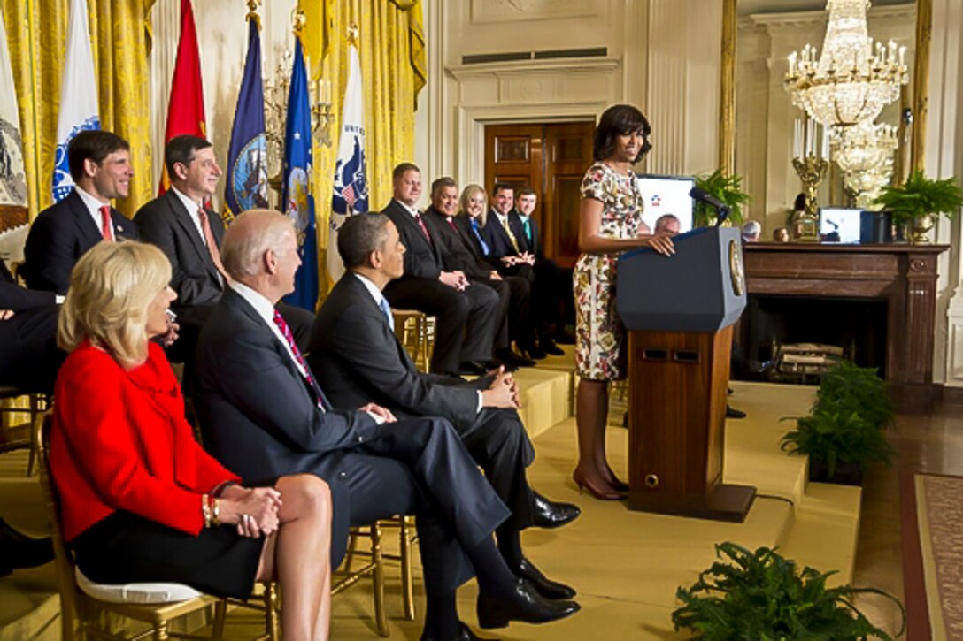 First Lady Michelle Obama challenges U.S. businesses to hire veterans and military spouses during a "Joining Forces" event at the White House, April 30, 2013. President Barack Obama, third from left, Vice President Joe Biden, second from left, and Biden's wife, Dr. Jill Biden, participated in the event. Some 290,000 veterans and military spouses have been hired since the launch of the hiring initiative two years ago, nearly tripling the initial goal. White House photo by Chuck Kennedy