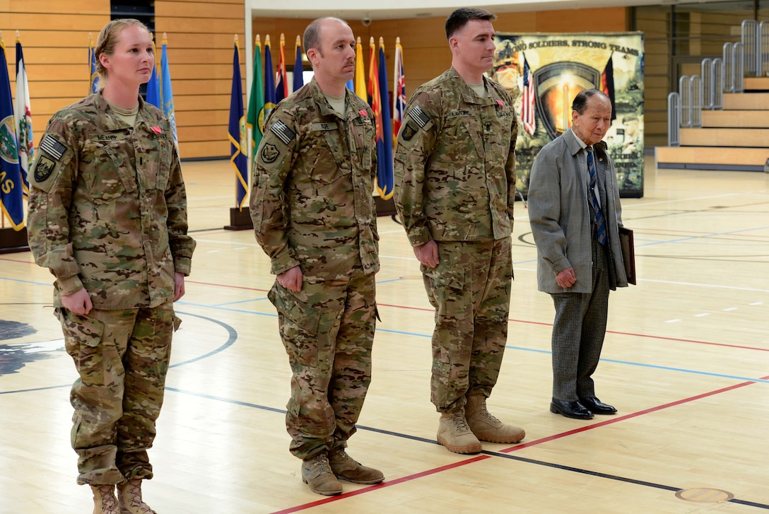 U.S. Army 1st Lt. Laura Means, left, Chief Warrant Officer 4 Robert Rupe, center, and Master Sgt. Mike Lavigne, second from right, stand before each receives the Bronze Star for their service from U.S. Army Chief of Staff Gen. Ray Odierno during his visit to Lucius D. Clay Kaserne, formerly Wiesbaden Army Airfield, in Wiesbaden, Germany, April 30, 2013. Odierno also acknowledged Arthur Chee, far right, with a 50-year pin and certificate for his service with the Army.