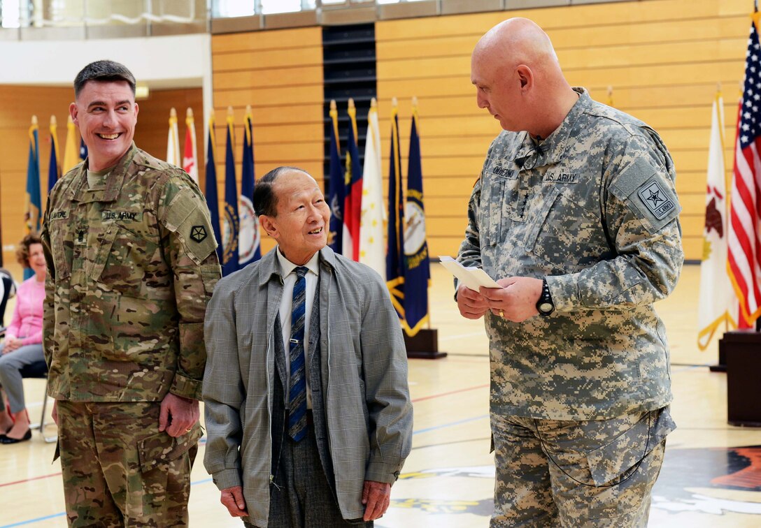 U.S. Army Chief of Staff Gen. Ray Odierno presents Arthur Chee with a 50-year pin and certificate for Chee's service with the U.S. Army during Odierno's visit to Lucius D. Clay Kaserne, formerly Wiesbaden Army Airfield, in Wiesbaden, Germany, April 30, 2013. Chee served more than 50 years with the Army.