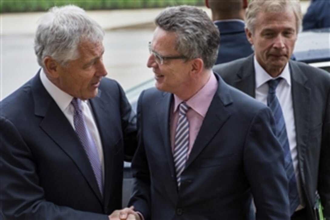 Secretary of Defense Chuck Hagel, left, welcomes Germany's Minister of Defense Thomas de Maiziere to the Pentagon on April 30, 2013.  Hagel, de Maiziere and their senior advisors will meet to discuss security items of interest to both nations.  