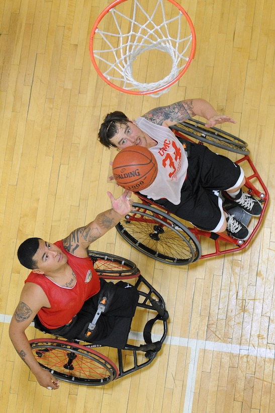Marine Cpl. Jorge Salazar and his teammates from the U.S. Marine Corps Wounded Warrior Regiment wheelchair basketball team hone their skills during practice in Colorado Springs, Colo. The team will compete during the 2013 Wounded Warrior Games at the U.S. Olympic Training Center and at the Air Force Academy in Colorado Springs, Colo., May 11-17. Throughout the seven-day event, wounded, ill and injured service members and veterans from the Marines, Army, Air Force, Navy, Coast Guard and Special Operations Command will compete for the gold in track and field, shooting, swimming, cycling, archery, wheelchair basketball and sitting volleyball. 