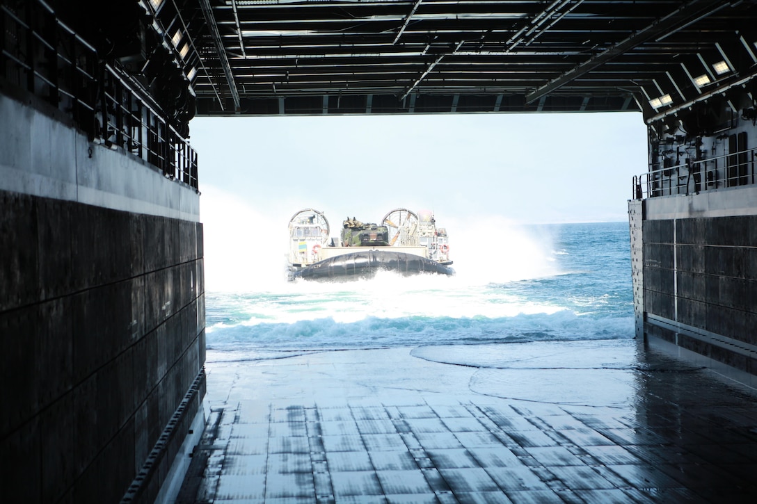 A landing craft air cushion prepares to load onto the USS Anchorage, April 22, 2013. Marines and sailors with Task Force Denali are currently en route to the ship’s namesake city of Anchorage, Alaska, for the commissioning ceremony scheduled for May 4.