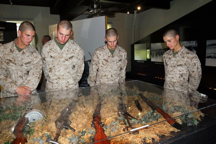 Recruits with Company I, 3rd Recruit Training Battalion, take a look at weapons used in Vietnam during a guided tour of the Command Museum aboard Marine Corps Recruit Depot San Diego April 17. Recruits were also able to see prior Marine uniforms, war photography and topographical maps at the Command Museum. 