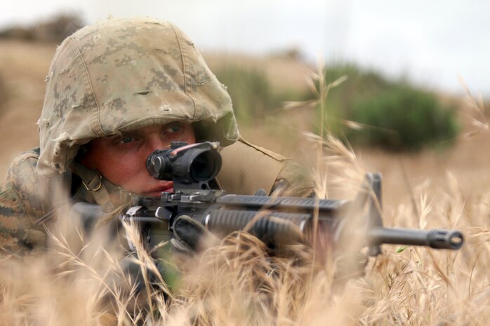 Pfc. Spencer Knudson, Platoon 3201, Company I, 3rd Recruit Training Battalion, posts security during a Crucible event on Edson Range aboard Marine Corps Base Camp Pendleton San Diego, Calif.  Knudson was selected as guide of his platoon on Training Day 4 and was able to sustain his leadership position throughout recruit training.