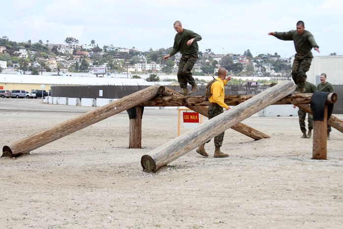Recruits of Company G, 2nd Recruit Training Battalion, must walk across the Log Walk during the Confidence Course aboard Marine Corps Recruit Depot San Diego April 16. Recruits cannot fall or stop during their attempt to cross otherwise they must start all over again.