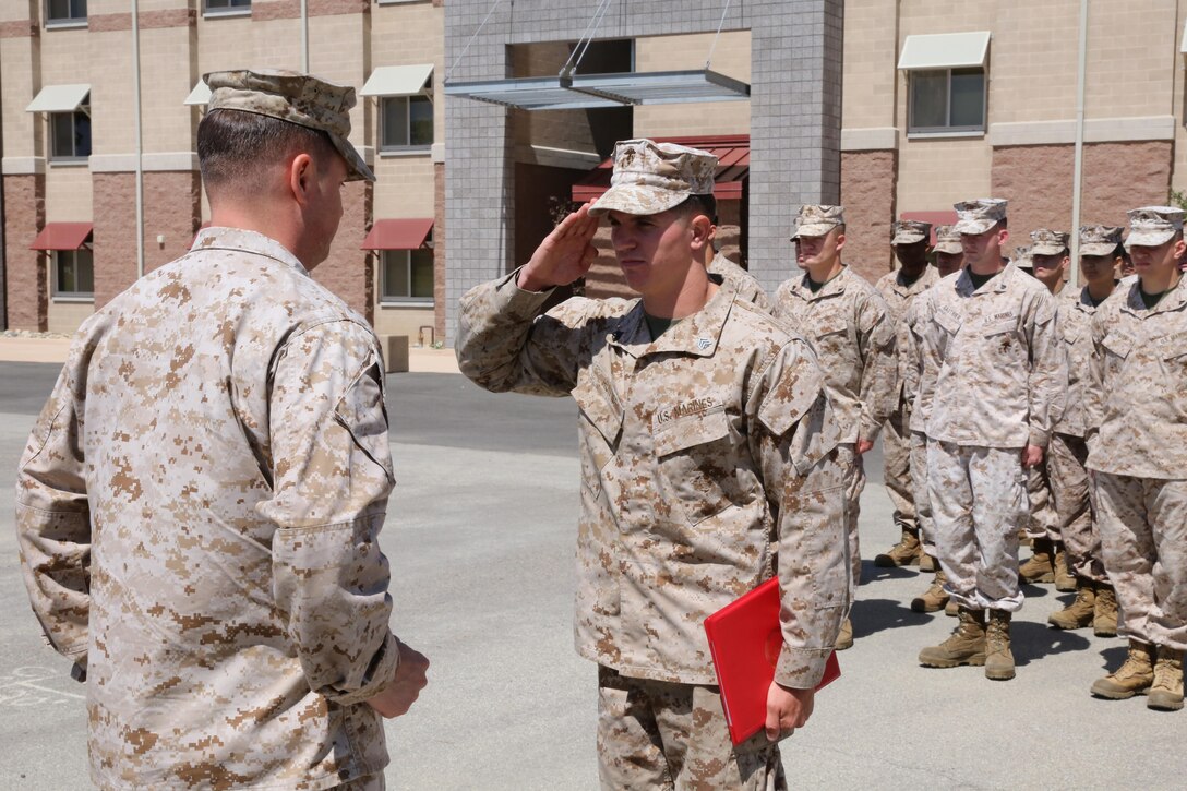 Sgt. Jacob Hunter, a field wireman with the 11th Marine Expeditionary Unit, salutes Lt. Col. Eddy Hansen, the executive officer of the 11th Marine Expeditionary Unit, after getting meritoriously promoted to sergeant, as part of a promotion ceremony here May 2. To be meritoriously promoted, a Marine must do everything within his ability to stand out among his peers. Hunter understood that concept and was meritoriously promoted to sergeant within three and a half years of service. “All the hard work has payed off at the end of the day,” said Hunter, the 21-year-old, Wilson, Pa., native. “It all comes down to doing your job and being the best at everything you do, while looking out for the Marines you’re responsible for.”