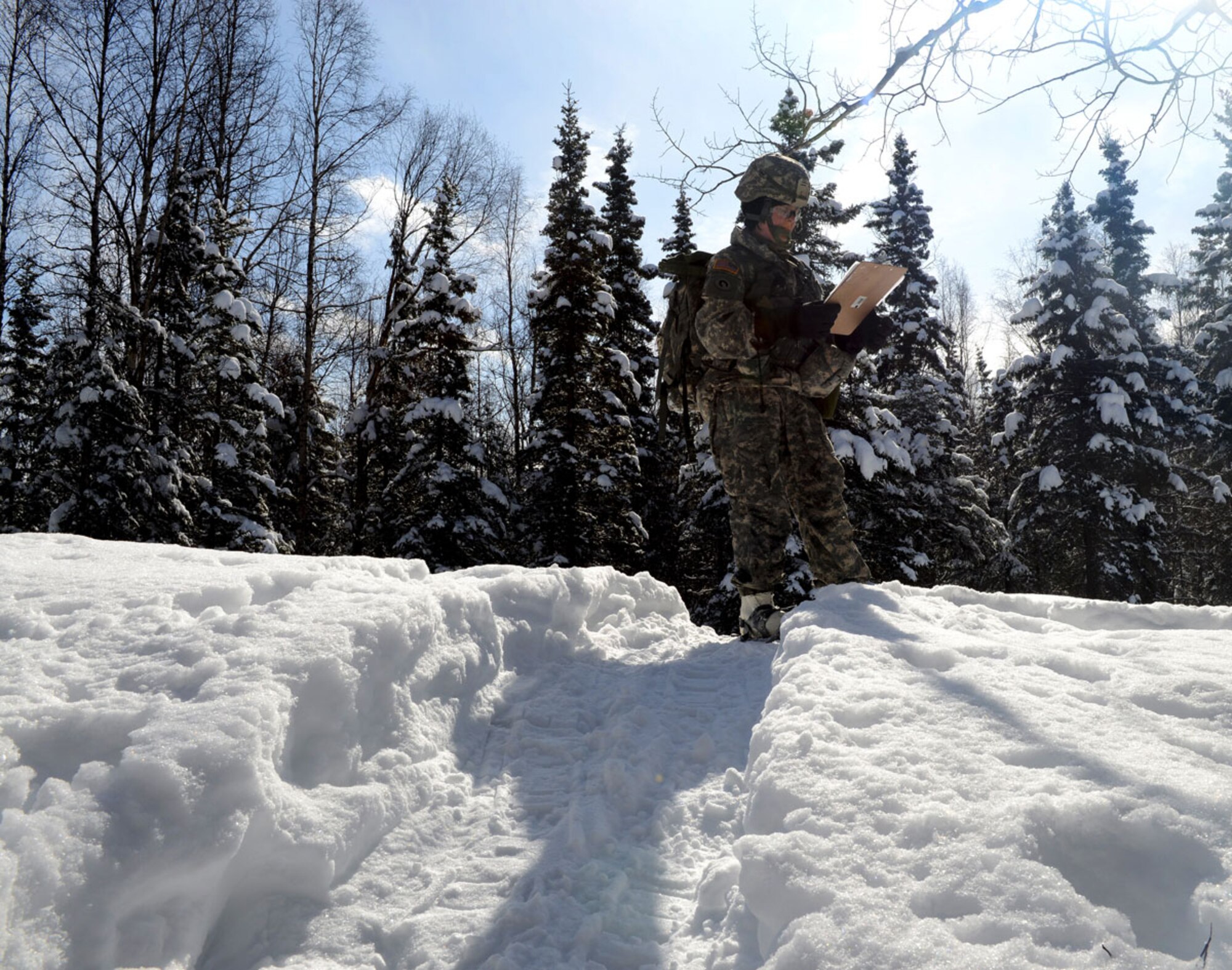 A Warrior Leader Course student checks his grid coordinates during a land navigation test at JBER April 11. Removed from WLC a few years back, land navigation returns to a revised WLC curriculum. (U.S. Air Force photo/Airman Ty-Rico Lea)

