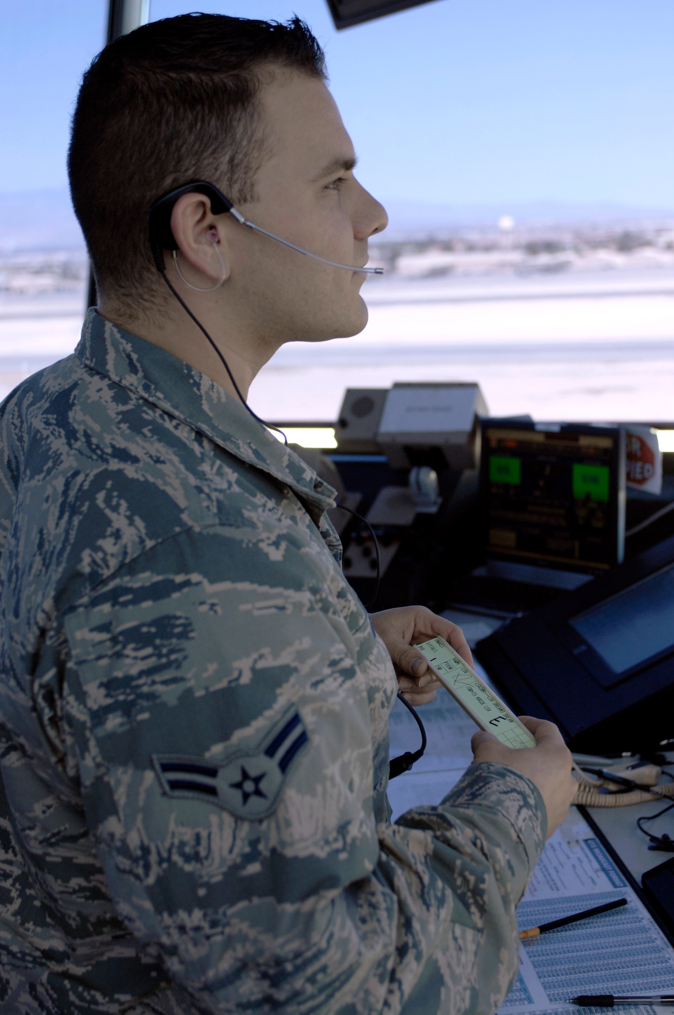 Airman 1st Class Markanthony Diaz, 57th Operations Support Squadron air traffic control apprentice, manages flight data while observing aircraft April 25, 2013. ATC apprentices typically start in the flight data position, managing departure and arrival times to ensure the expeditious flow of air traffic. (U.S. Air Force photo by Airman 1st Class Joshua Kleinholz)