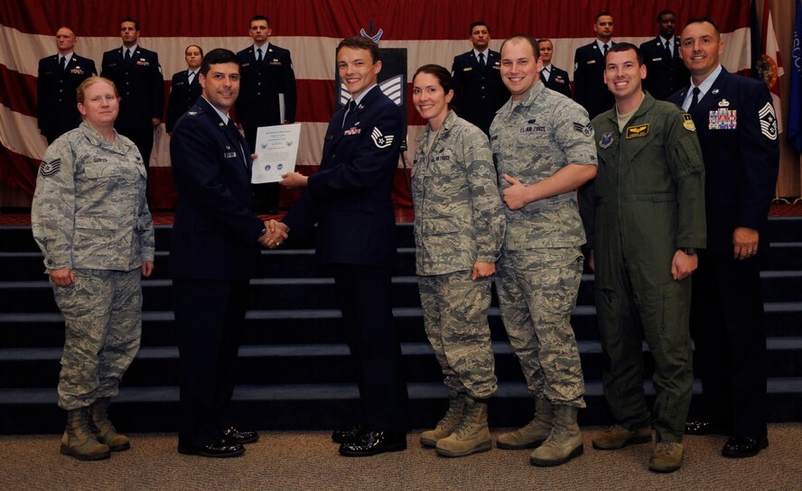 Staff Sgt. Chet Long, 2nd Aircraft Maintenance Squadron, receives a certificate of promotion to Staff Sgt. from Col. Andrew Gebara, 2nd Bomb Wing Commander, during the May Wing Promotion Ceremony on Barksdale Air Force Base, La., May 1, 2013.