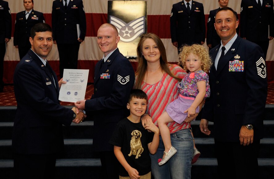 Staff Sgt. David Pickren, 2nd Maintenance Squadron, receives a certificate of promotion to Staff Sgt. from Col. Andrew Gebara, 2nd Bomb Wing Commander, during the May Wing Promotion Ceremony on Barksdale Air Force Base, La., May 1, 2013.