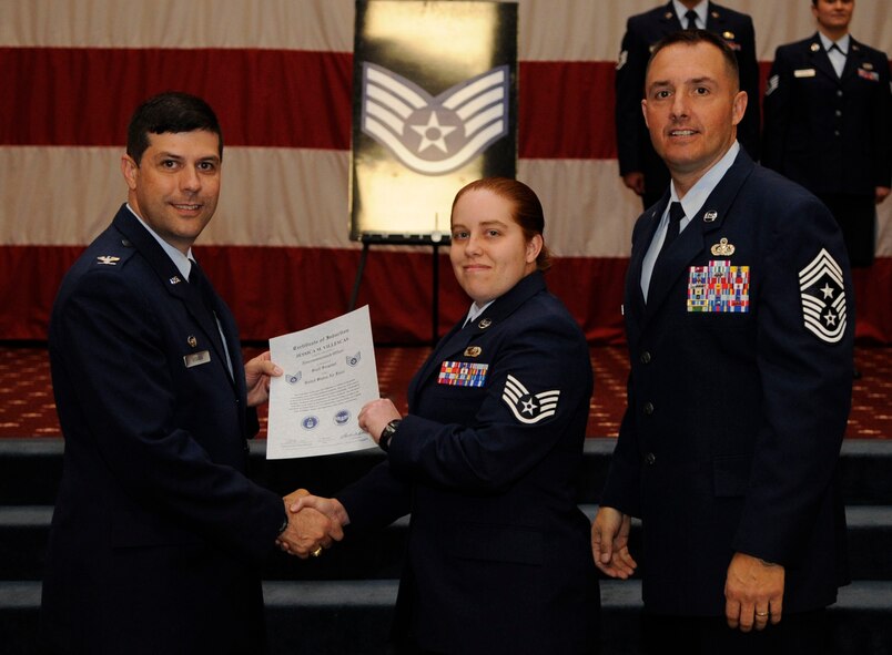 Staff Sgt. Jessica Villescas, 2nd Force Support Squadron, receives a certificate of promotion to Staff Sgt. from Col. Andrew Gebara, 2nd Bomb Wing Commander, during the May Wing Promotion Ceremony on Barksdale Air Force Base, La., May 1, 2013.