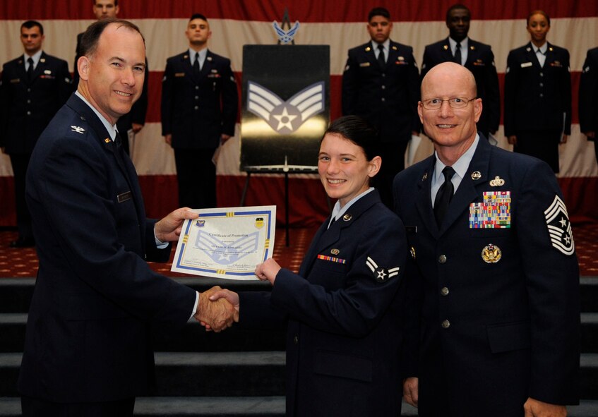 Airman 1st Class Shandi Edwards, 26th Operational Weather Squadron, receives a certificate of promotion to Senior Airman from Col. Russell Mathers, 8th Air Force Chief of Staff, during the May Wing Promotion Ceremony on Barksdale Air Force Base, La., May 1, 2013.