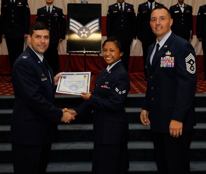Airman 1st Class Tyler Hall, 2nd Munitions Squadron, receives a certificate of promotion to Senior Airman from Col. Andrew Gebara, 2nd Bomb Wing Commander, during the May Wing Promotion Ceremony on Barksdale Air Force Base, La., May 1, 2013.
