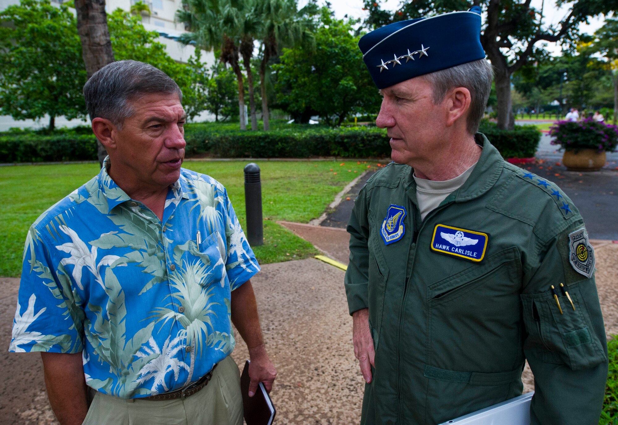 Retired Air Force Lt. Gen. Dan Leaf (left), Asia-Pacific Center for Security Studies director, speaks with Gen. Hawk Carlisle, commander of Pacific Air Forces, after Carlisle's arrival at the APCSS , in Honolulu, Hawaii. The APCSS mission is building capacities and communities of interest by educating, connecting, and empowering security practitioners to advance Asia-Pacific security.  (U.S. Air Force photo by Staff Sgt. Nathan Allen)
