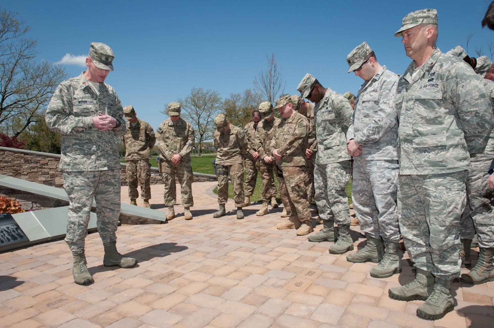 Chaplain (Maj.) Eric Boyer, 87th Air Base Wing chaplain, offers a prayer at the Air Advisor Memorial Remembrance Ceremony April 26, 2013, at Joint Base McGuire-Dix-Lakehurst, N.J. The event commemorated the two-year anniversary of the shooting in Kabul, Afghanistan,  that claimed the lives of nine Air Advisors, April 27, 2013.  A bell was rung during the recitation of the names of the fallen, followed by turning on of the memorial’s fountain and a moment of silence. (U.S. Air Force photo by Russ Meseroll/Released)