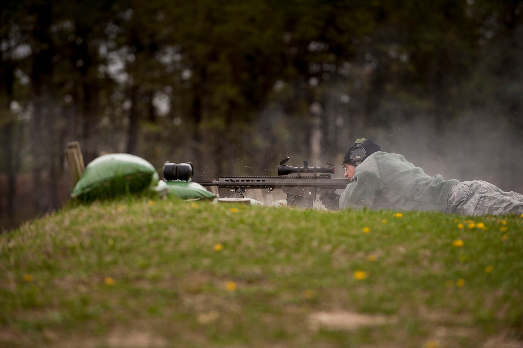 Airman 1st Class Eli Marquez, 87th Explosive Ordnance Disposal journeyman, trains on the M107 .50 caliber rifle, April 22, 2013, at Joint Base McGuire-Dix-Lakehurst, N.J.  The EOD technicians use the rifle as a tool in the clearance of runways of unexploded ordnance.  The rifle can be used to fire at unexploded ordnance in order to detonate or break them apart. The process for this is called standoff munitions disruption. Marquez hails from Miami, Okla. (U.S. Air Force photo by Russ Meseroll/Released)