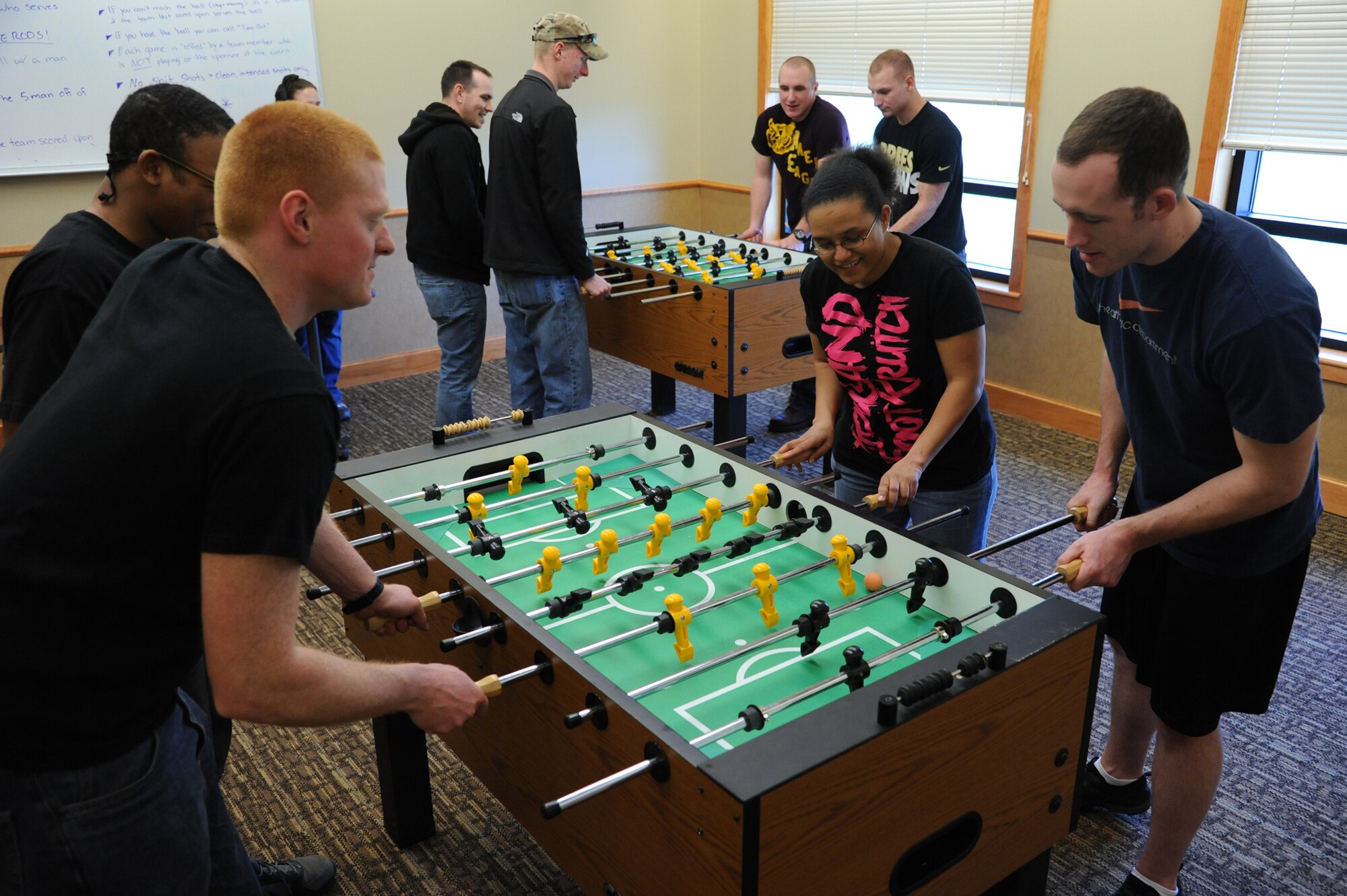 (Clockwise from left) Airman 1st Class Tyler Dietrick, 341st Civil Engineer Squadron member, and Airman 1st Class Kavon Evans, 341st CES structural apprentice, play a game of foosball against Staff Sgt. Shaleena Pulliam, 341st Medical Operations Squadron dental assistant, and Senior Airman Wyatt Stinnett, 341st MDOS. The next Wing Sports Smackdown is scheduled for July 18 at the Grizzly Bend. (U.S. Air Force photo/Airman 1st Class Katrina Heikkinen)

