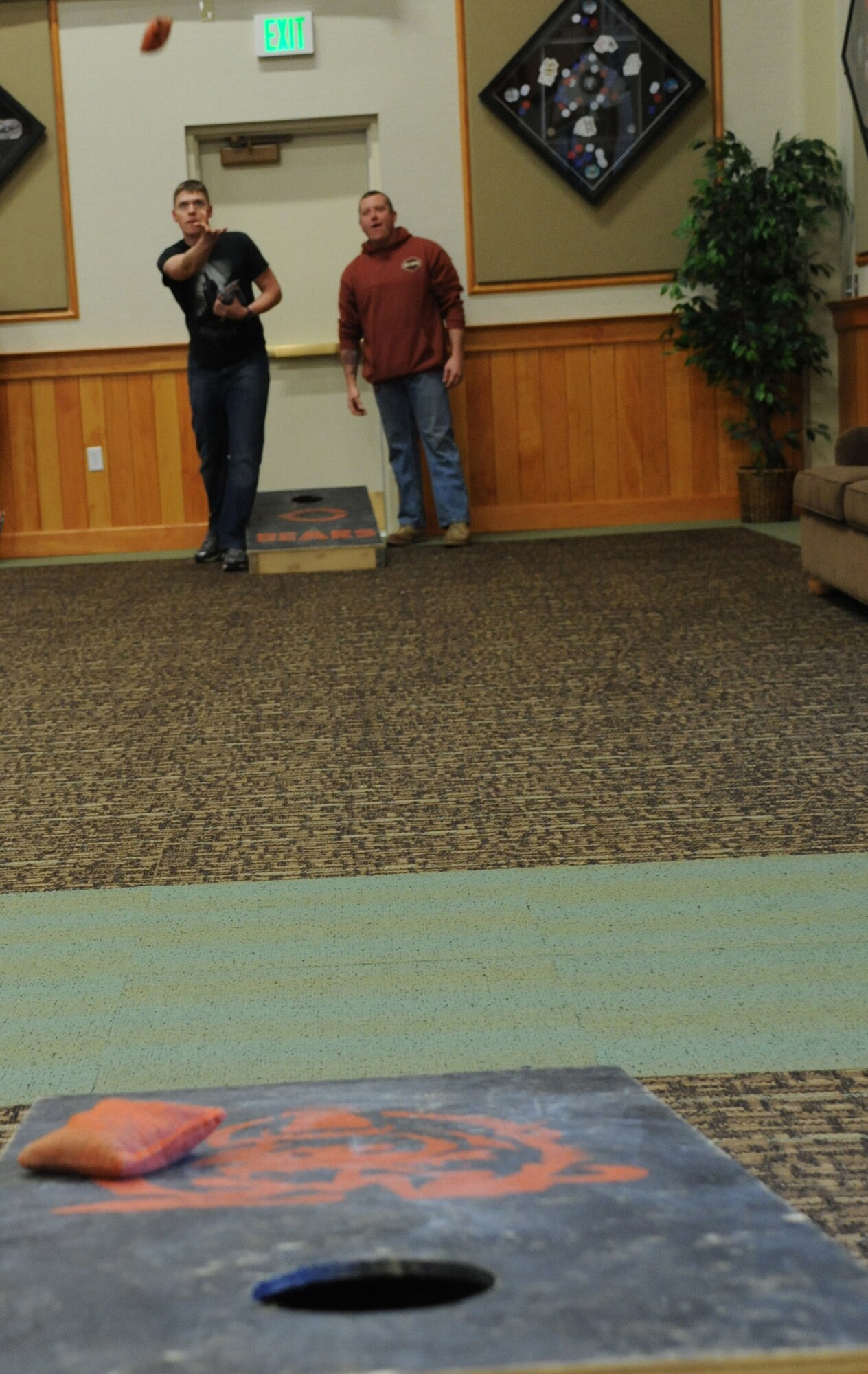 Airman 1st Class Anthony Trabanino, 341st Civil Engineer Squadron member, (left) plays a game of cornhole with Tech. Sgt. Jeffrey Payne, 341st CES power production NCO in charge. The two helped the 341st Missions Support Group walk away with the coveted Wing Sports Smackdown trophy, taking it away from its previous winner, the 341st Security Forces Group. (U.S. Air Force photo/Airman 1st Class Katrina Heikkinen)