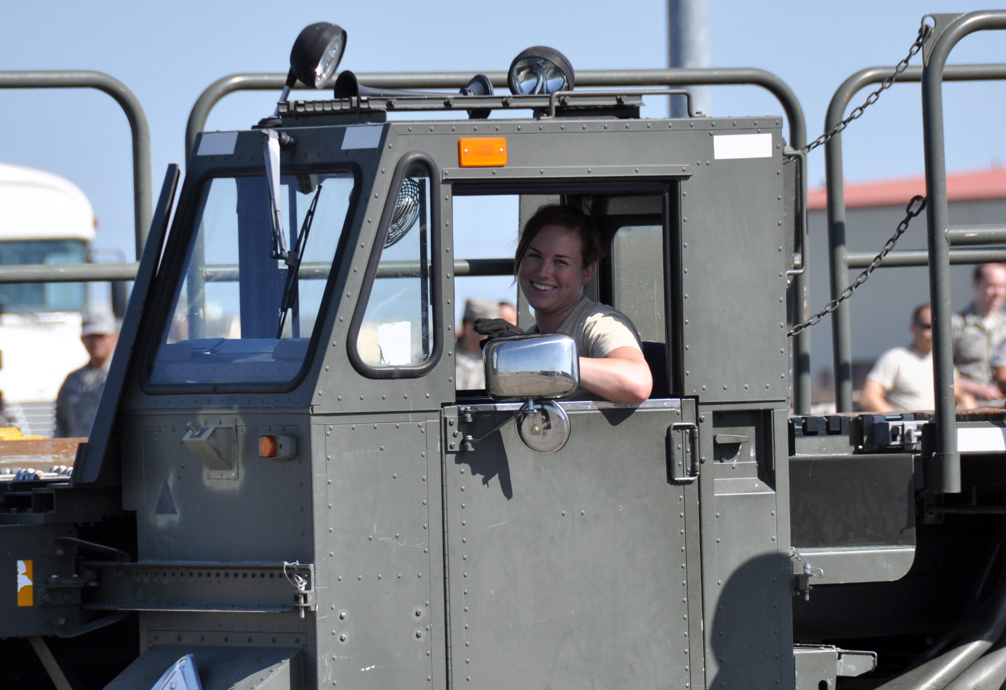 TRAVIS AIR FORCE BASE, Calif. --Senior Airman Mary Wolfe, air terminal operations center information controller with the 55th Aerial Port Squadron drives a 60K Tunner aircraft cargo loader during a friendly competition and training event  with the 82nd Aerial Port Squadron on April 21, 2013. (U.S. Air Force photo / Senior Airman Cindy Alejandrez)