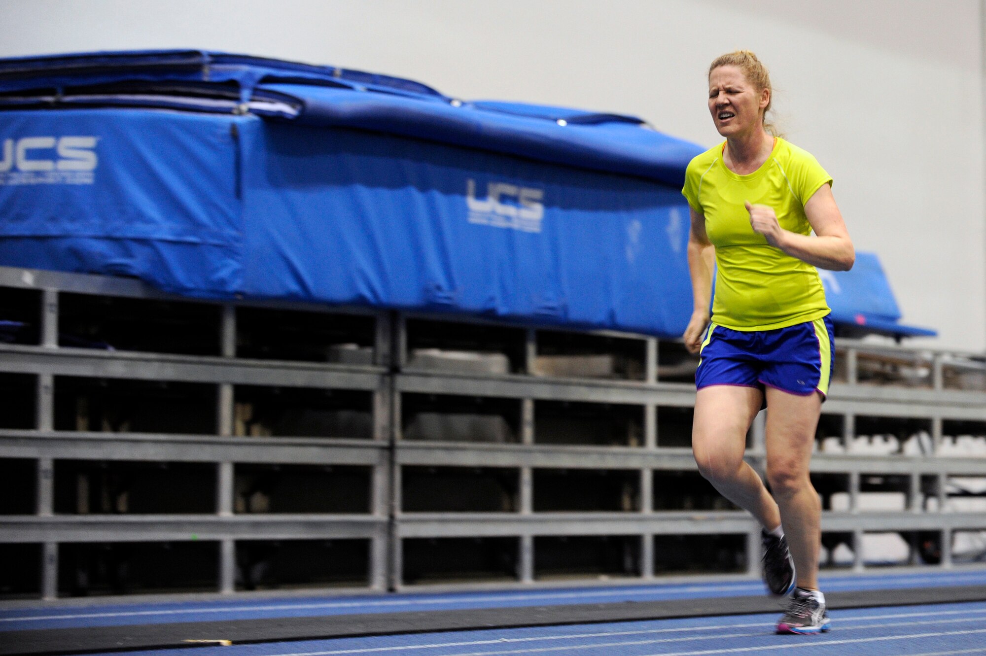 Katie Robinson pushes herself as she runs laps at the Academy Indoor Track during the Wound Warrior Games Training Camp held in Colorado Springs, Colo., April 17, 2013. Robinson resides in Detroit. (U.S. Air Force photo/Desiree Palacios)