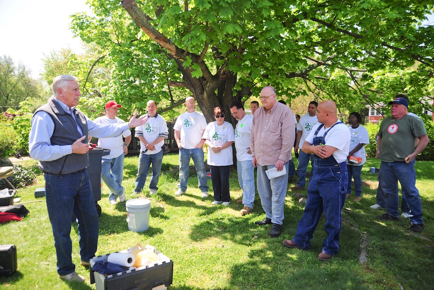 Steny Hoyer, representative of the 5th District of Maryland, addresses Team Andrews and community volunteers, and homeowner John Rogers on April 27, 2013, at the culmination of the 25th Christmas in April event. The long-standing program is a community effort to spruce up homes of low-income, disabled and elderly people. (U.S. Air Force photo/Staff Sgt. Amber Russell)