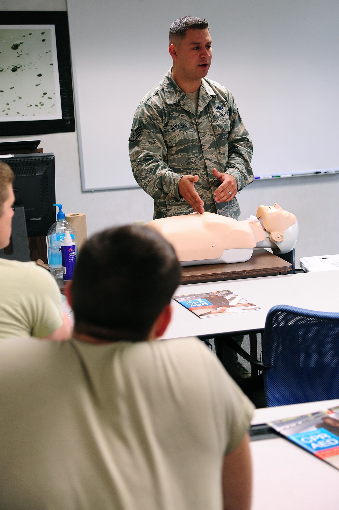 Staff Sgt. John Gonzales, a 314th Maintenance Operation Flight instructor, teaches a Self-Aid and Buddy Care class May 1, 2013, at Little Rock Air Force Base, Ark. Gonzales has taught 162 classes totaling 694 hours of training across three major commands. (U.S. Air Force photo by Airman 1st Class Kaylee Clark)