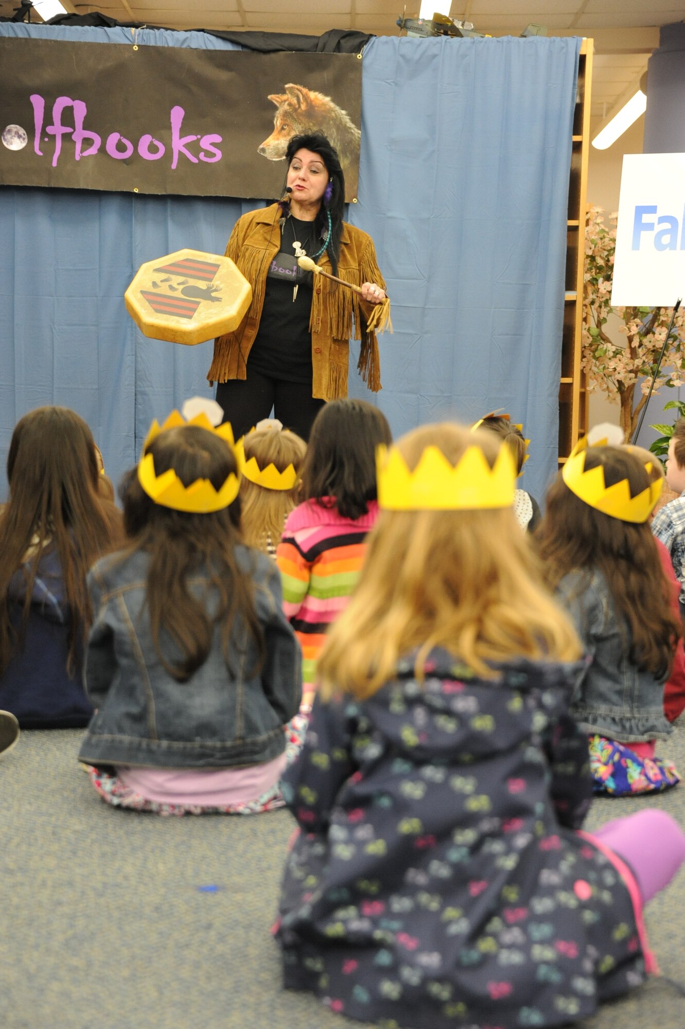 Maria Cirillo, Wolfbooks author and illustrator, reads one of her books to children at Blue Star Families’ Appreciating Military Kids, Appreciating the Earth event April 27, 2013, at the Joint Base McGuire-Dix-Lakehurst, N.J., Librar-e and Resource Commons. Children earned a star during Cirillo’s story time reading to go toward a free book from Blue Star Families. (U.S. Air Force photo by Airman Sean M. Crowe/Released)