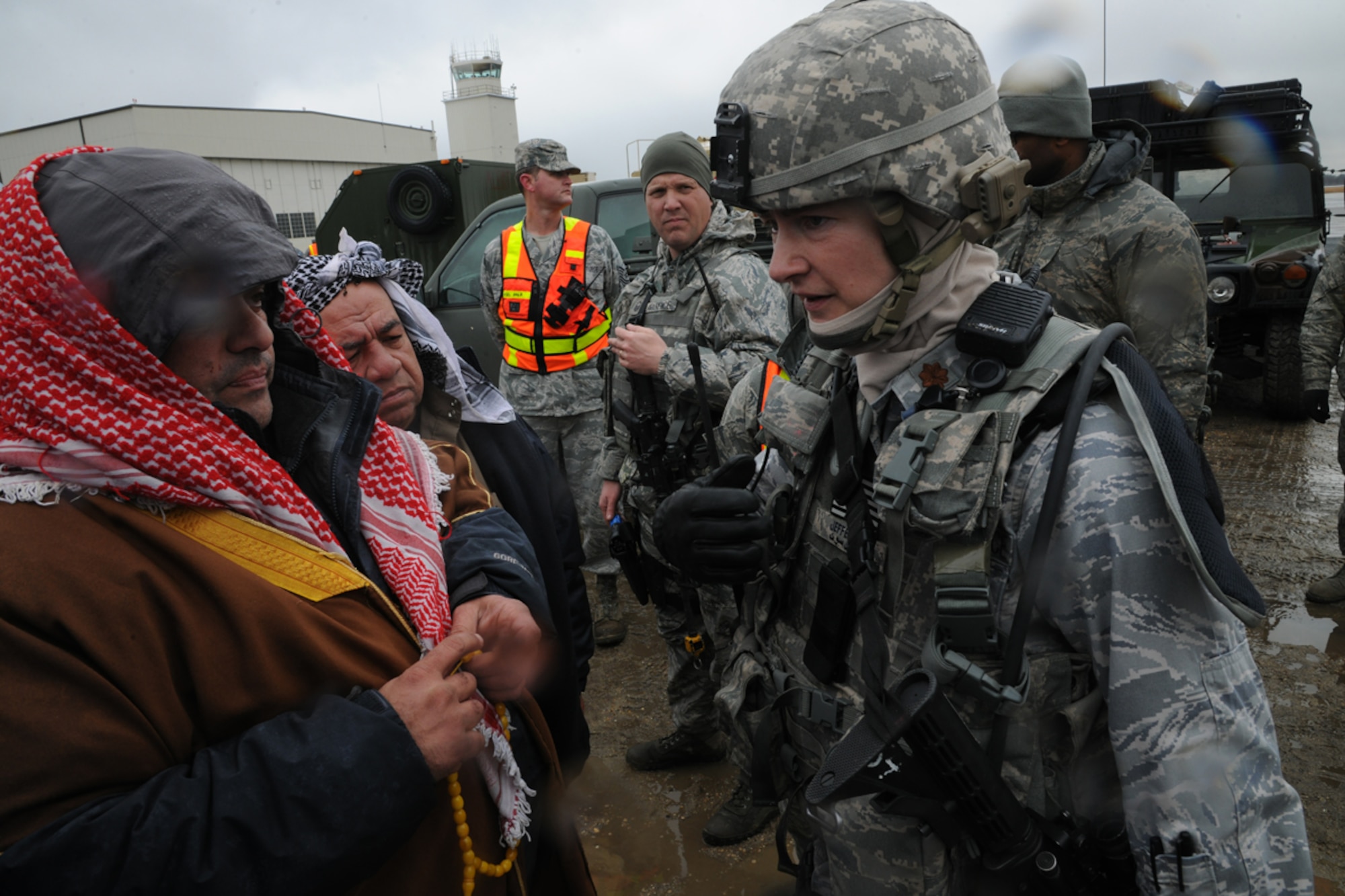 Maj. Julia Jefferson, 817th Global Mobility Readiness Squadron commander, speaks with a contract role player portraying a village leader during a demonstration scenario as part of U.S Air Force Exercise Eagle Flag 13-2 March 19, 2013, at Joint Base McGuire-Dix-Lakehurst, N.J.  Several hundred members from the 621st Contingency Response Wing from JB MDL and Travis Air Force Base, Calif., teamed up with U.S. Army Soldiers to open and operate an aerial port in a fictitious country during the two week exercise.  (U.S. Air Force photo by Tech. Sgt. Zachary Wilson/Released)