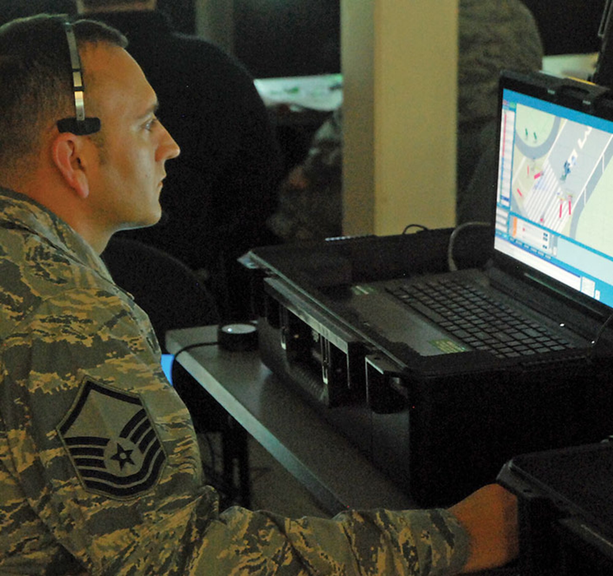 FORT RILEY, Kansas -- Master Sgt. Stephen Thompson, NCOIC, Fire Officer Courses, DoD Fire Academy, runs the controls of the ADMS Norma Brown simulator during a Fire Officer II course April 12 at Fort Riley. The training marked the debut of the mobile training system, which is designed to provide incident command training for firefighters. (U.S. Army photo/Julie Fiedler) 