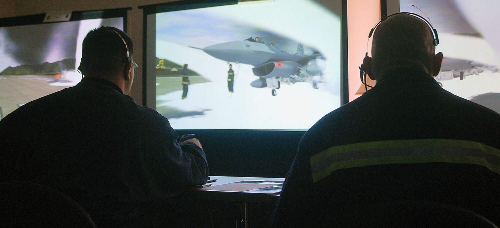 FORT RILEY, Kansas-- Two firefighters operate the Norma Brown simulator during a Fire Officer II course April 12 at Fort Riley. The training marked the debut of the mobile training system that is designed to provide incident command training for fire fighters. (U.S. Army photo/Julie Fiedler) 