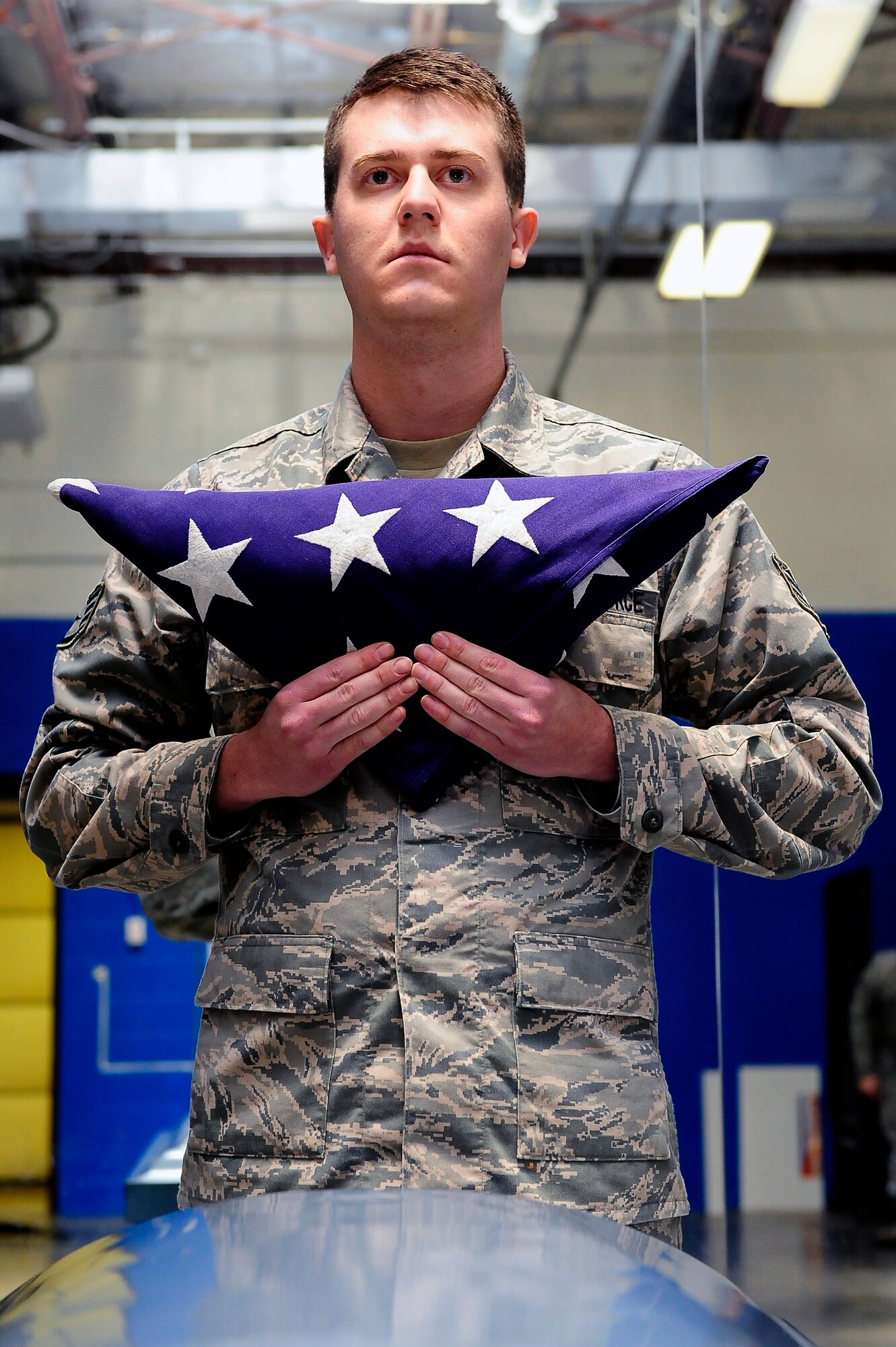 Staff Sgt. Jacob Larman, 509th Bomb Wing Honor Guard A-Team member, prepares to present the flag during training at Whiteman Air Force Base, Mo., April 23, 2013. Being able to turn off emotions and keep military bearing are vital during flag presentations. (U.S. Air Force photo by Airman 1st Class Shelby R. Orozco/Released)
