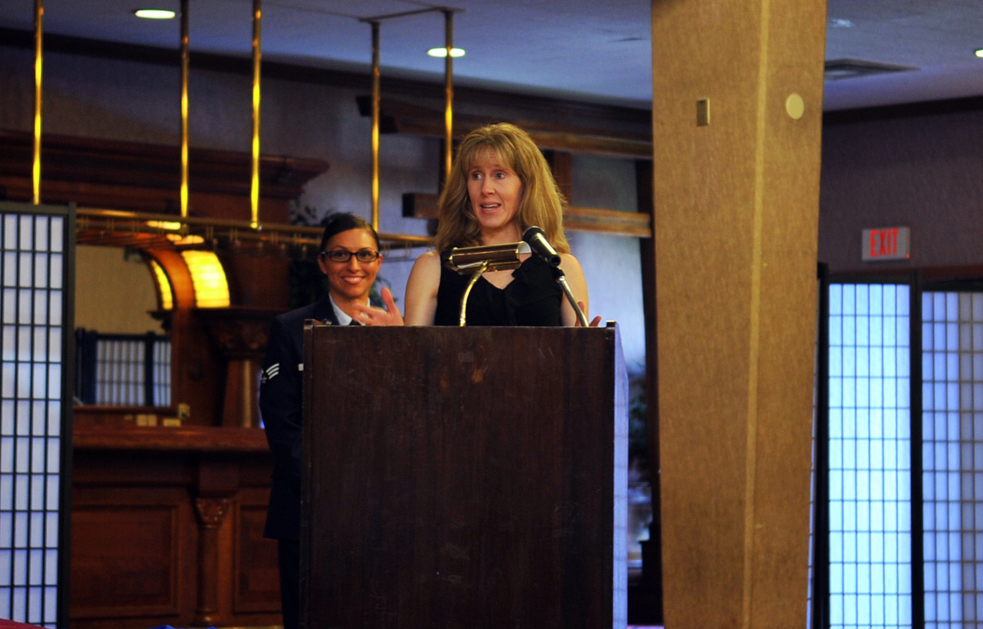 Kati Molloy, wife of U.S. Air Force Brig. Gen. Matt Molloy, 18th Wing commander, gives thanks to participants during the annual volunteer recognition ceremony in the Rocker NCO Club ballroom on Kadena Air Base, Japan, April 15, 2013. The volunteers saved $11,167,790.10 from April 2012 to March 2013 and were recognized by the general, for dedicating 512,519 volunteer hours in 2012. (U.S. Air Force photo by Naoto Anazawa/Released)

