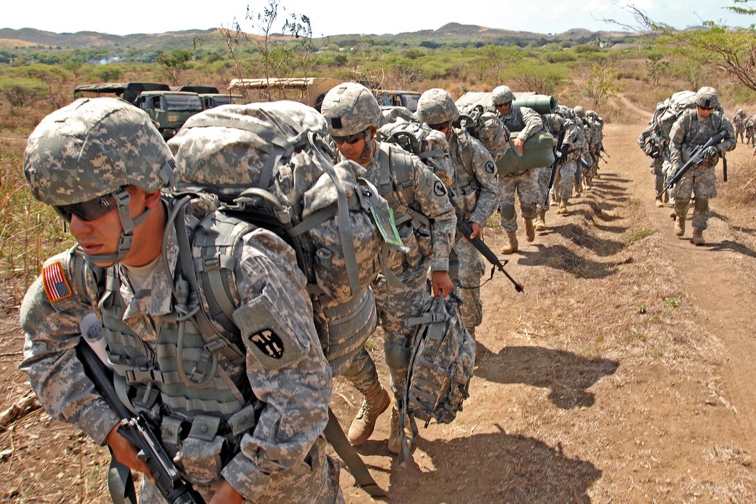 U.S. soldiers conduct a patrol exercise during the Army's leader course on Camp Santiago Joint Maneuver Training Center in Salinas, Puerto Rico, April 22, 2013.