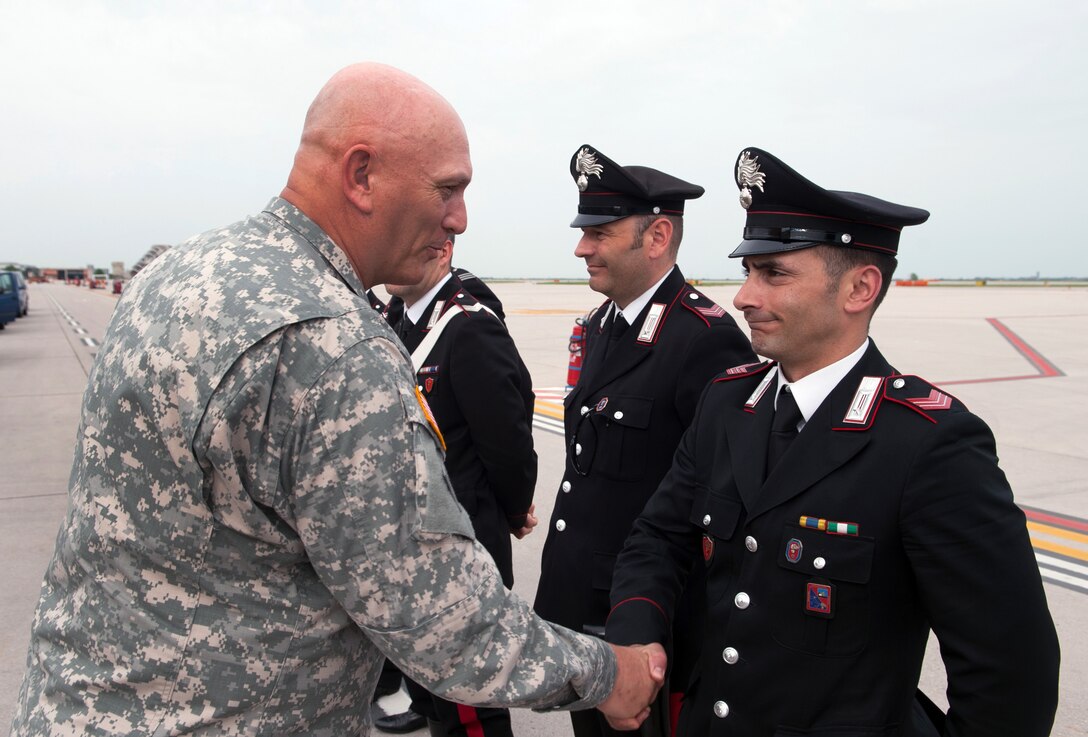 U.S. Army Chief of Staff Gen. Ray Odierno presents coins for excellence to Italian police officers in Vicenza, Italy, May 1, 2013. 