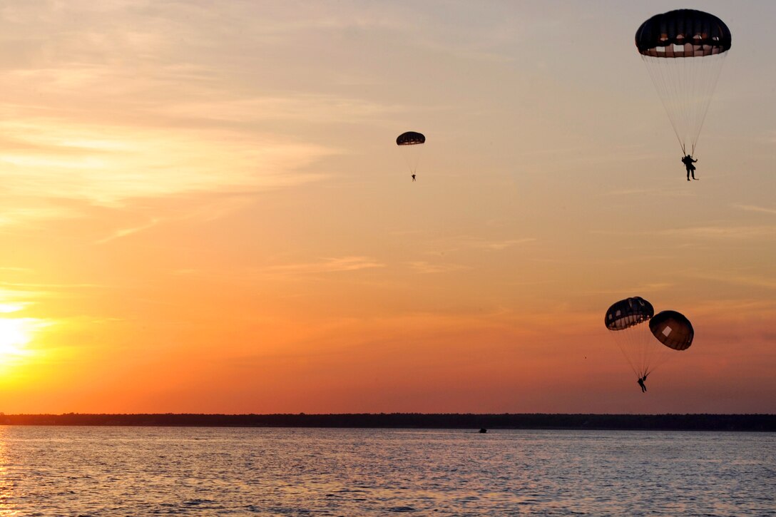 Special operations soldiers parachute out of an Air Force C-17 Globemaster III aircraft to conduct a training mission over water during Emerald Warrior 2013 on Hurlburt Field, Fla., April 26, 2013.