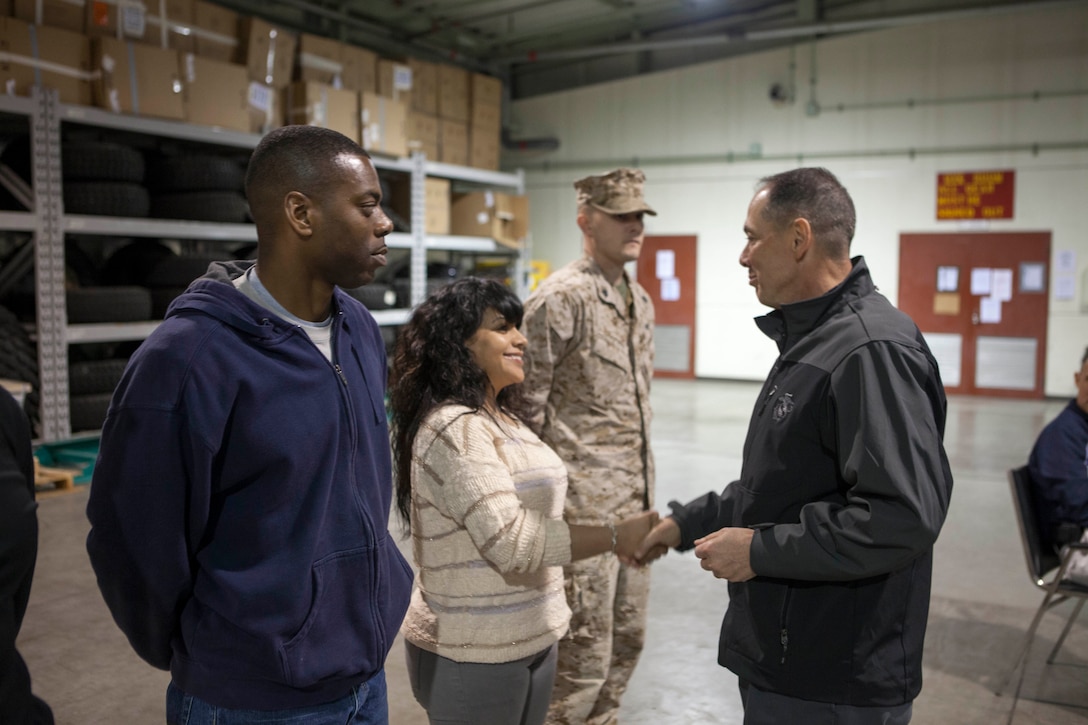 Maj. Gen. Peter J. Talleri, right, shakes hands with Staff Sgt. Cynthia E. Vasquez April 18 during a visit to the Combined Arms Training Center, Camp Fuji, Japan. Talleri recognized the officers and senior enlisted Marines for their tireless efforts during the commanding general’s inspection program that took place a few weeks earlier. Vasquez is the postal chief for CATC Camp Fuji and Talleri is the commanding general of Marine Corps Installations Pacific.