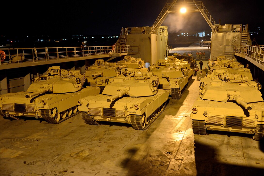 M1A1 Abrams tanks are staged for off-load on the deck of Army Logistics Support Vessel 4 off the shore of Pohang, Republic of Korea, April 19. The vehicles drove to shore from the LSV over an Army trident pier system. The tanks were off-loaded during Combined Joint Logistics Over The Shore 2013, a biennial MPF exercise. The LSV-4 is a part of the U.S. Army’s 163rd Transportation Detachment. photos by Cpl. Mark W. Stroud