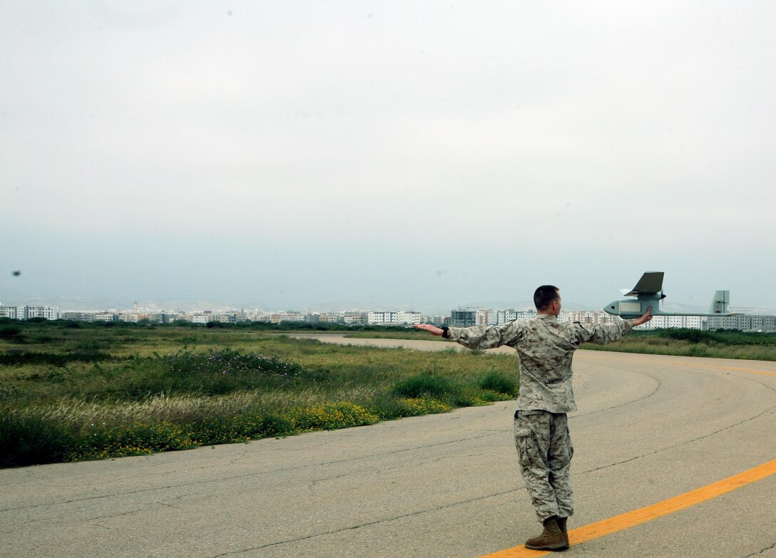 U.S. Marines, along with German and Moroccan counterparts, conducted a small unmanned-flying vehicle familiarization course for Exercise African Lion 13, April 13, in Agadir, Morocco, that shared the capabilities of the RQ-11B Raven as part of the Intelligence Capacity Building Workshop. Exercise African Lion 13 was a U.S. Africa Command-directed, U.S. Marine Corps Forces Africa-led multi-lateral military engagement between U.S., Moroccan and German armed forces. The joint task force consisting of U.S. Marines, soldiers, sailors and airmen were able to conduct modified bi-lateral and joint training for Exercise African Lion 13 demonstrating their ability to adapt to unpredicted circumstances, restore mission-essential tasks, build interoperability and create friendships during the three-week evolution. The logistics component exercised vigilant, safe and rapid retrograde of almost 1,200 personnel and 250 short-tons of vehicles and equipment while working with Moroccan partners and contractors to sustain the force and redeploy them back to their home stations in a timely and efficient manner. 