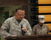 : Lt. Cmdr. Danny Purvis, a member of the Chaplain Corps aboard Camp Lejeune, N.C., leads the room in an invocation during a Silver Star Medal award ceremony aboard Camp Lejeune, N.C., April 30, 2013. The ceremony was held to award Staff Sgt. Daniel W. Ridgeway, an explosive ordnance disposal team leader with 2nd Explosive Ordnance Disposal Company, 8th Engineer Support Battalion, 2nd Marine Logistics Group, for his actions in Afghanistan in 2011. (U.S. Marine Corps photo by Lance Cpl. Shawn Valosin)