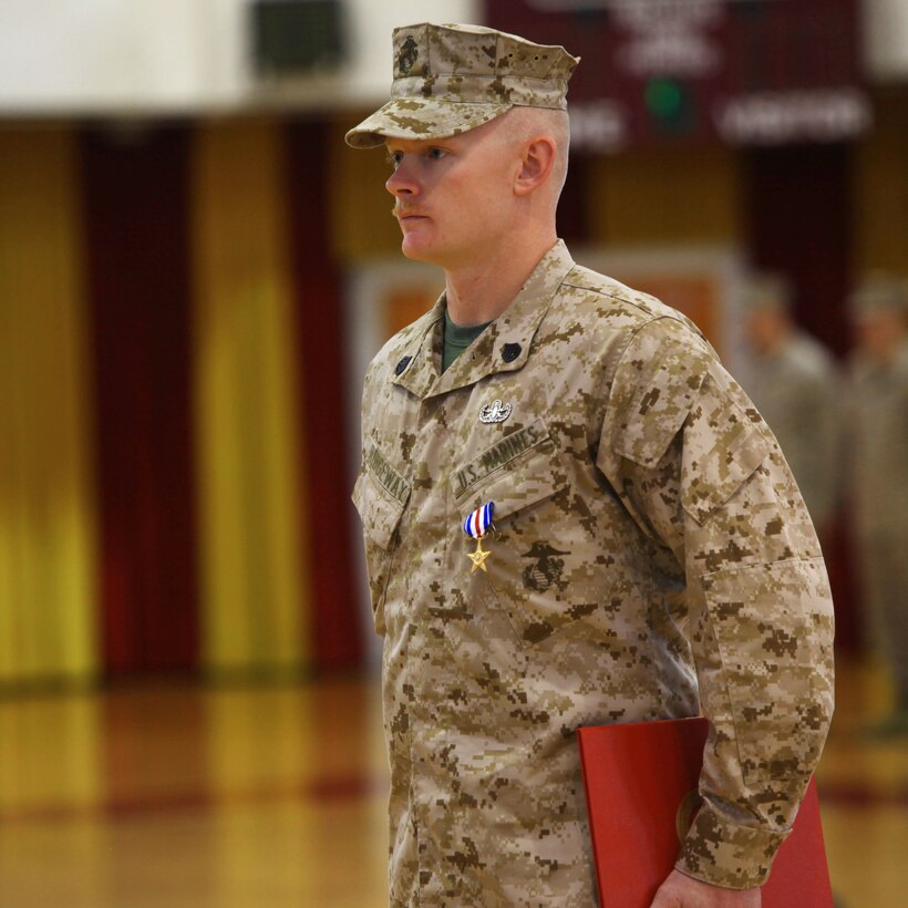 Staff Sgt. Daniel W. Ridgeway, an explosive ordnance disposal team leader with 2nd Explosive Ordnance Disposal Company, 8th Engineer Support Battalion, 2nd Marine Logistics Group, stands at attention after being awarded the Silver Star Medal aboard Camp Lejeune, N.C., April 30, 2013. Ridgeway was awarded for “conspicuous gallantry and intrepidity in action against the enemy in support of Operation Enduring Freedom.” (U.S. Marine Corps photo by Lance Cpl. Shawn Valosin)