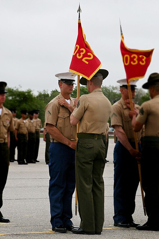 Private First Class Scott Taylor, Jr., honor graduate of platoon 2032, participates in the retiring of the guidon portion of graduation aboard Parris Island, S.C., May 3, 2013. Taylor is a native of Deltona, Fla., and recruited from Deland, Fla., by Staff Sgt. Markus Wiley, recruiter from RS Jacksonville. Taylor will be able to enjoy some much deserved leave as he prepares for Marine Combat Training in Camp Geiger, N.C. (U.S. Marine Corps photo by Lance Cpl. John-Paul Imbody)