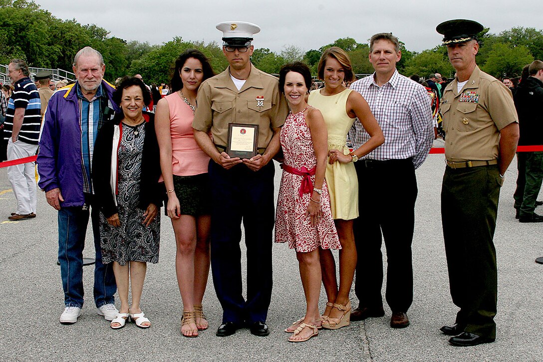 Private First Class Brandon Layman, honor graduate of platoon 2034, stands with Col. Robert Jones, Regimental Commander of Recruit Training, and his family after graduation aboard Parris Island, S.C., May 3, 2013. Layman is a native of St. Gabriel, La., and recruited from Baton Rouge, La., by Gunnery Sgt. Kiel Shaw, recruiter from RSS Lake Charles RS Baton Rouge. Layman will be able to enjoy some much deserved leave as he prepares for Marine Combat Training in Camp Geiger, N.C. (U.S. Marine Corps photo by Lance Cpl. John-Paul Imbody)