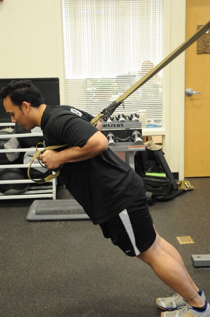 Physical Trainer, Brian Hancock, demonstrates the starting position for the Sprinter Start exercise on April 4, 2013, at the Barber Physical Activity Center aboard Marine Corps Base Quantico. This exercise can help improve run times.