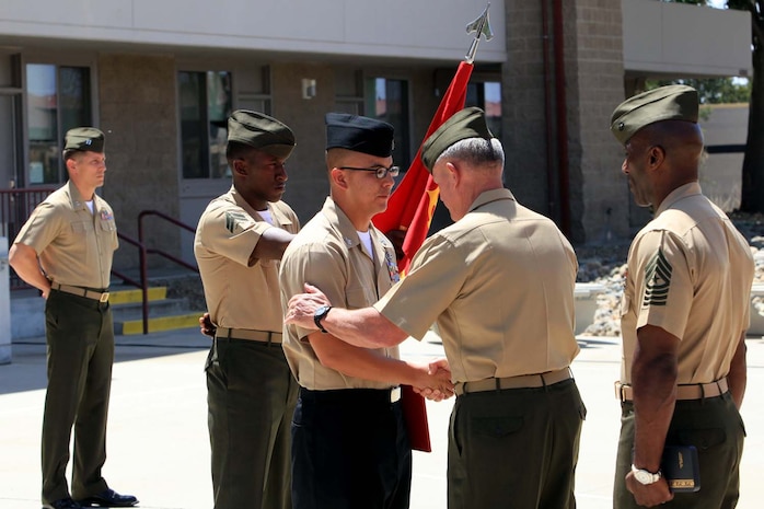 Maj. Gen. Charles M. Gurganus, commanding general of I Marine Expeditionary Force (Forward), presents and congratulates Petty Officer 1st Class Benny Flores, a corpsman serving with Air Naval Gunfire Liaison Company, with the Silver Star during a ceremony at Camp Pendleton, May 3. Flores was recognized for his actions on April 28, 2012, while serving with Regional Command Southwest providing medical support on a mission to Zaranj, Nimroz province, Afghanistan.