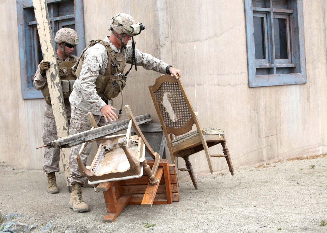 Marines with 13th Marine Expeditionary Unit, create a barricade during a training exercise at the infantry immersion trainer at Camp Pendleton, Calif., April 29. The 13th MEU is preparing for their upcoming deployment by immersing Marines in scenario-based training exercises to enhance and test their ability to work together and accomplish an assigned mission.