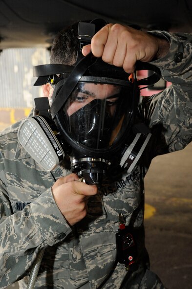 Senior Airman Michael Mazolla, 2nd Maintenance Squadron Accessories Flight Fuels Maintenance section, puts on a respirator prior to performing maintenance of the fuel systems of a B-52H Stratofortress on Barksdale Air Force Base, La., May 3, 2013. Fuels Airmen have the responsibility of diagnosing and repairing the various fuel systems and fuel tanks on the B-52 to ensure the aircraft completes its mission of delivering precision munitions on the battlefield. (U.S. Air Force photo/Airman 1st Class Andrew Moua)