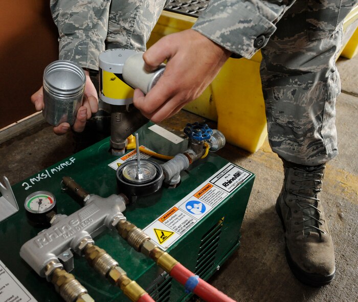 Senior Airman Michael Mazolla, 2nd Maintenance Squadron Accessories Flight Fuels Maintenance, changes the filter of an air ventilator on Barksdale Air Force Base, La., May 3, 2013. The air ventilator is used to provide fuels Airmen with a source of oxygen while conducting repairs of a B-52H Stratofortress fuel systems. (U.S. Air Force photo/Airman 1st Class Andrew Moua)