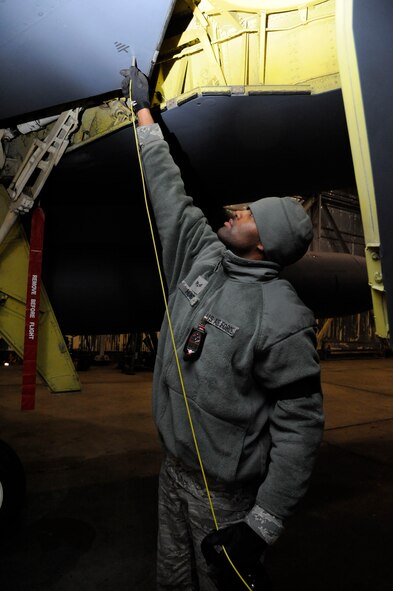 Senior Airman John Hunt, 2nd Maintenance Squadron Accessories Flight Fuels Maintenance, connects a bonding wire to a B-52H Stratofortress on Barksdale Air Force Base, La., May 3, 2013. Bonding wires are used by maintenance Airmen to safely discharge static electricity on their bodies before and during maintenance. (U.S. Air Force photo/Airman 1st Class Andrew Moua)