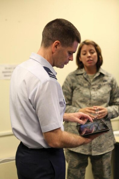 Col. David Murphy (left), 782nd Training Group commander, works with the new mobile app, "Torqued," on a tablet device with help from Tech. Sgt. Lisa Parker, 367th Training Support Squadron, during a visit to Hill Air Force Base, Utah, April 18. Torqued, the first major mobile application released by the 367th TRSS Instructional Training Unit, was designed to give Air Force maintainers the ability to calculate complicated torque settings on the fly while on the flight line. (Courtesy photo)